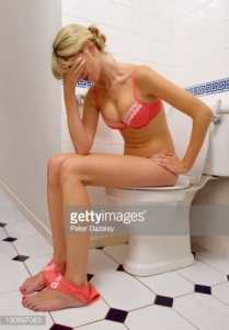 Unwell girl on toilet